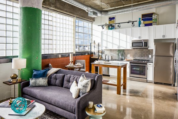 Spacious living room with modern decor in Hecht Warehouse Apartments