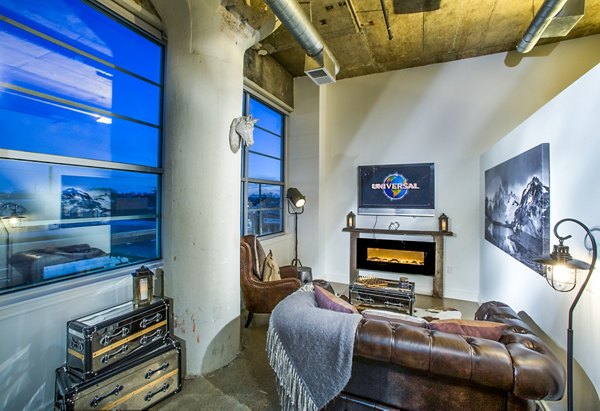 Spacious living room with industrial decor in Hecht Warehouse Apartments