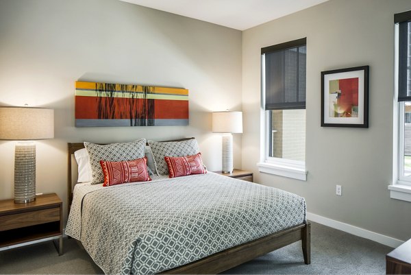 Comfortable bedroom with modern decor at Willow & Maple Apartments