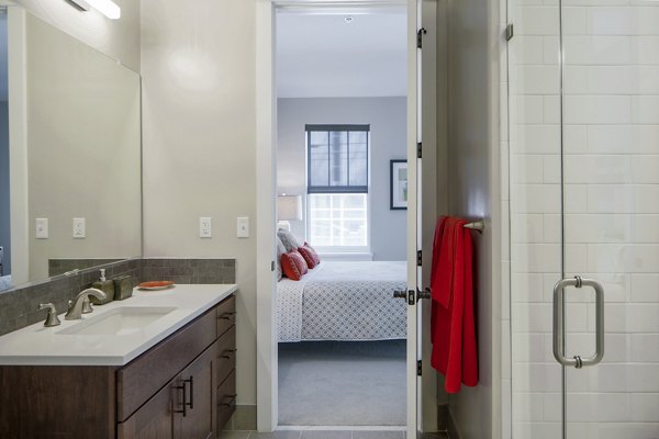 Contemporary bathroom with sleek fixtures at Willow & Maple Apartments