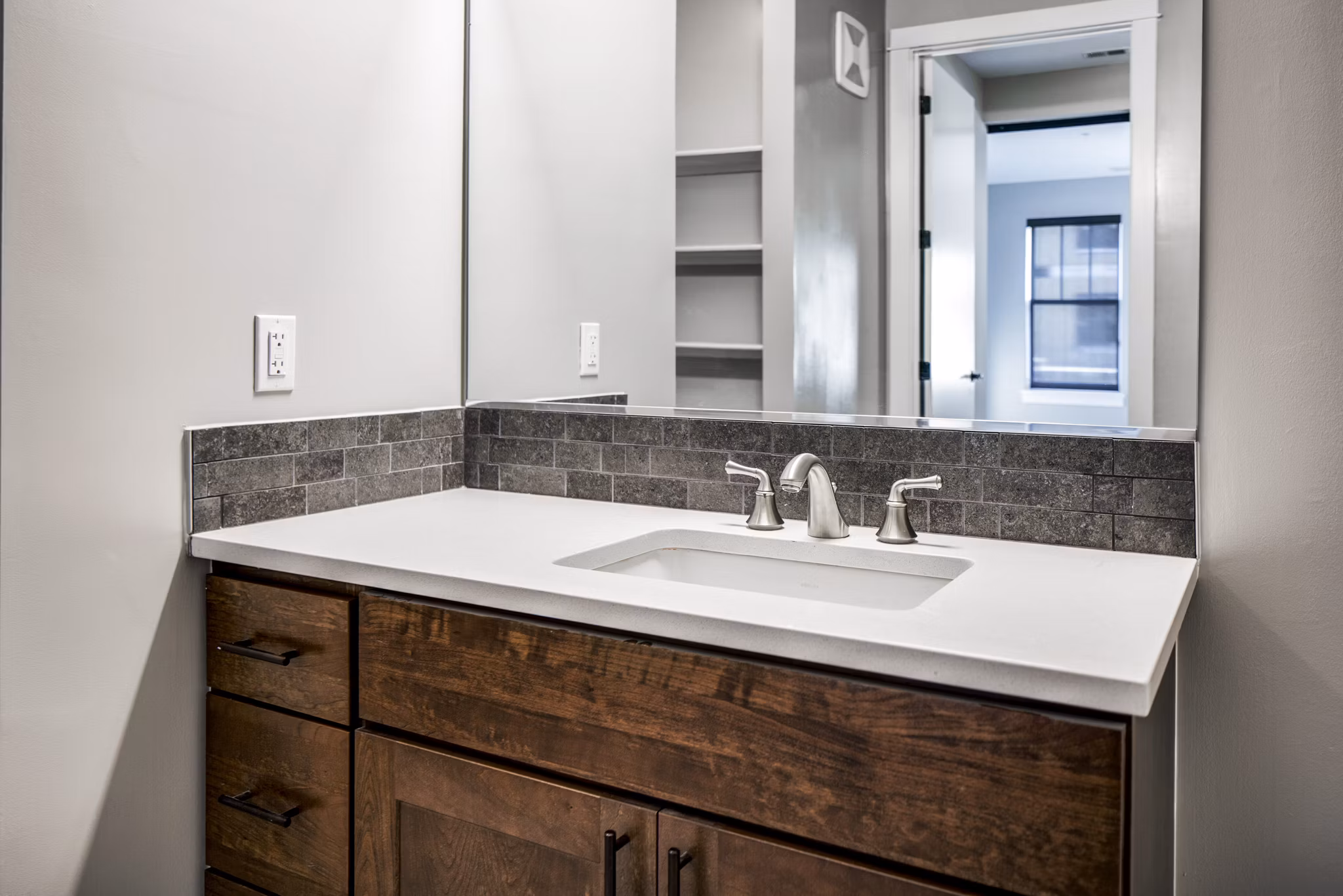 Modern bathroom with sleek fixtures in Willow & Maple Apartments