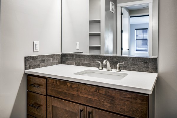 Modern bathroom with sleek fixtures in Willow & Maple Apartments