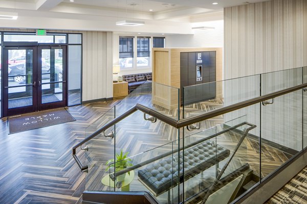 Clubhouse lobby featuring modern seating and decor at Willow & Maple Apartments