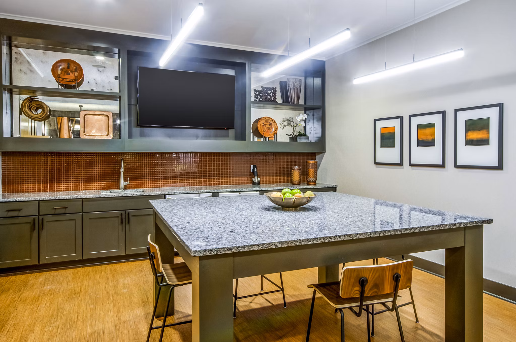 Clubhouse lobby featuring modern decor and seating at Willow & Maple Apartments