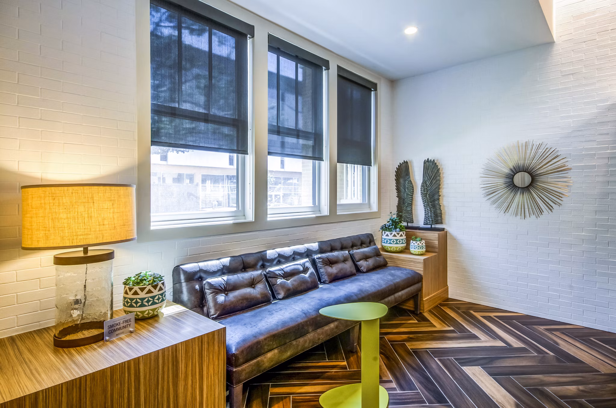 Clubhouse lobby featuring modern seating and decor at Willow & Maple Apartments