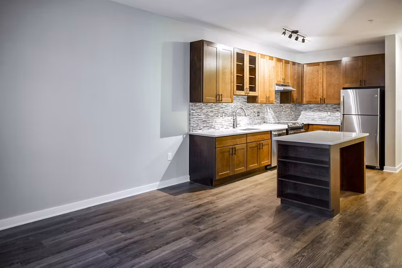 Dining room with modern decor and elegant lighting at Willow & Maple Apartments