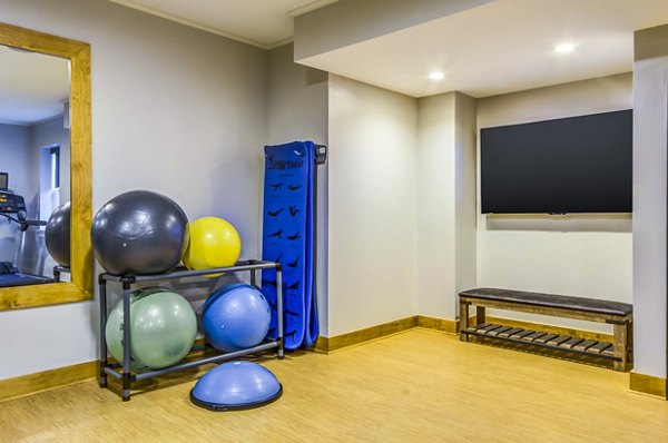 Yoga studio featuring modern equipment at Willow & Maple Apartments for relaxation and wellness