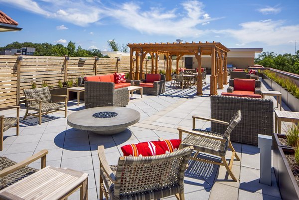 Cozy fire pit lounge area at Willow & Maple Apartments