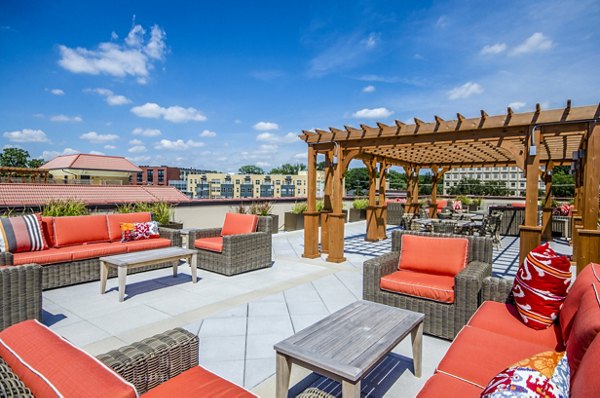 Expansive balcony with garden views at Willow & Maple Apartments, ideal for relaxation and outdoor dining in luxury living settings