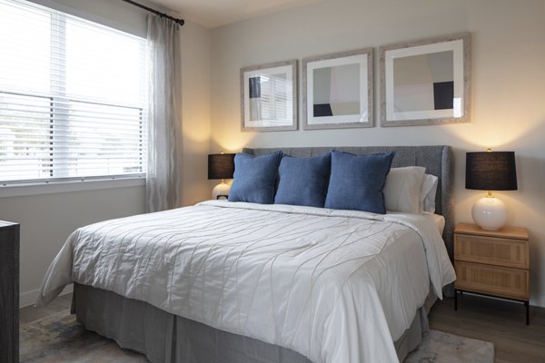 Bedroom featuring modern design and large windows at Prose Westover Hills Apartments in upscale San Antonio neighborhood