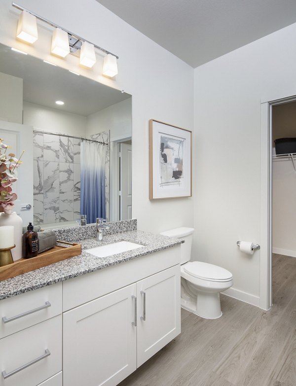 Bathroom with modern fixtures and ample storage at Prose Westover Hills Apartments