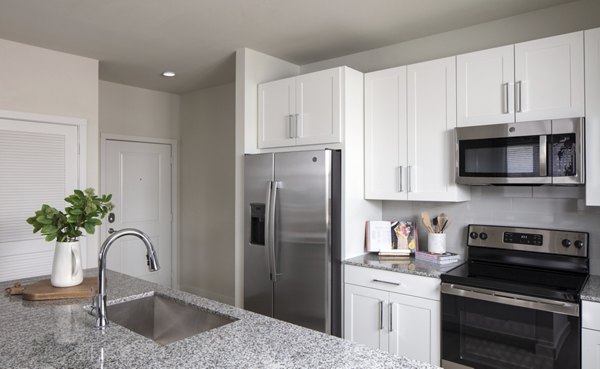 Modern kitchen with stainless steel appliances at Prose Westover Hills Apartments