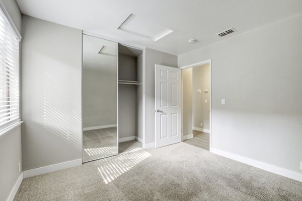 Bedroom featuring modern decor and ample natural light at Avana Vista Point Apartments