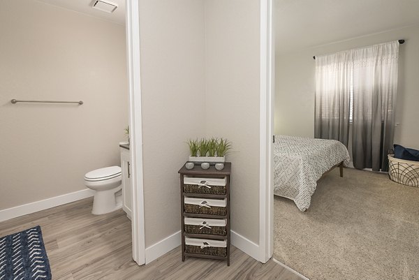 Bright hallway with modern lighting fixtures in Avana Vista Point Apartments