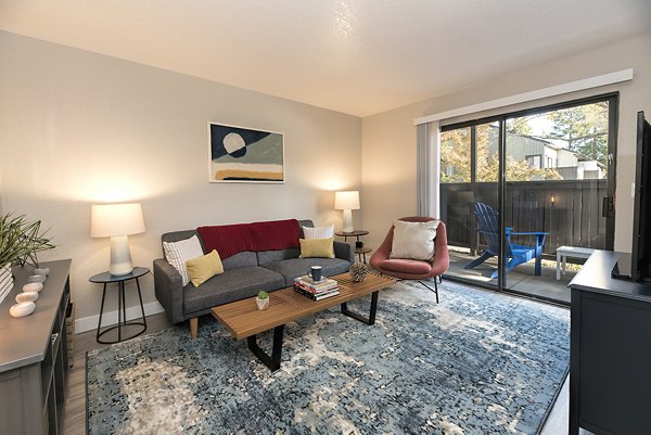 Cozy living room with modern furnishings at Avana Vista Point Apartments, luxury Greystar community