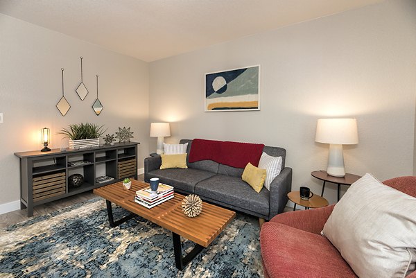 Cozy living room with modern dÃ©cor and ample seating at Avana Vista Point Apartments, ideal for relaxation and socializing