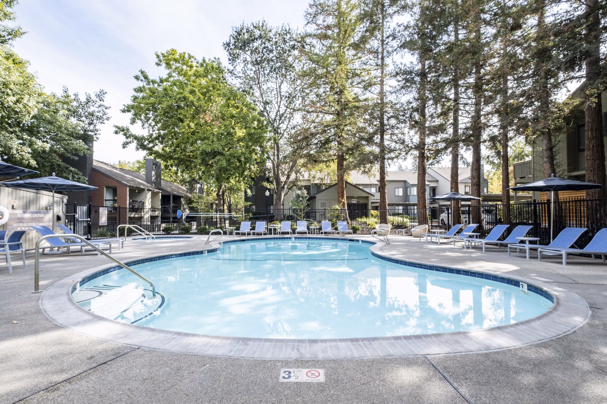 Resort-style pool with lounge chairs at Avana Vista Point Apartments offering luxury living experience