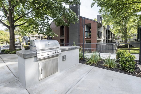 Outdoor grill area with modern seating at Avana Vista Point Luxury Apartments