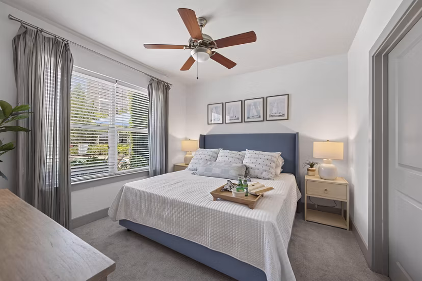 Modern bedroom with elegant decor at The Landing at Vinnin Square Apartments