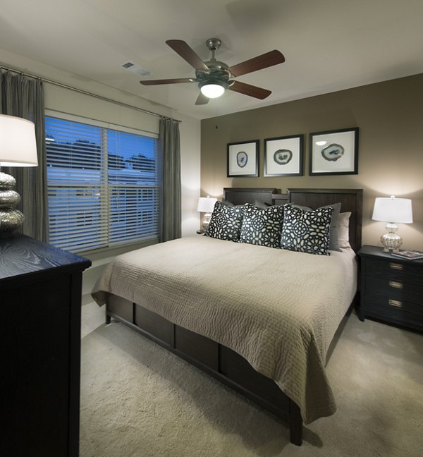 Spacious bedroom with elegant decor at The Landing at Vinnin Square Apartments