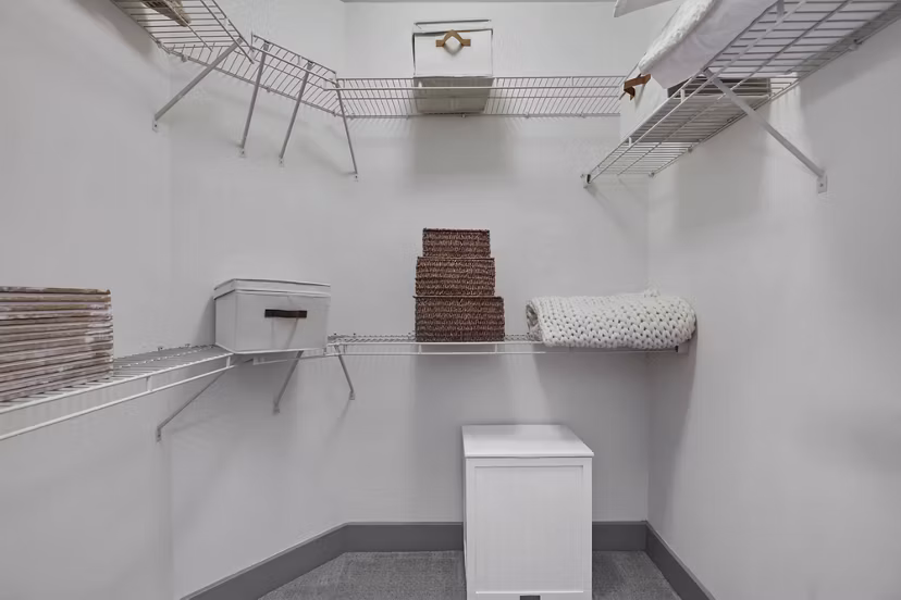 Bedroom featuring elegant decor and ample natural light at The Landing at Vinnin Square Apartments