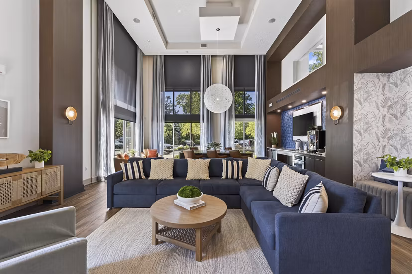 Clubhouse featuring modern decor and lounge seating at The Landing at Vinnin Square Apartments