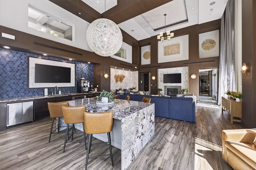 Clubhouse featuring modern lounge seating and billiards table at The Landing at Vinnin Square Apartments Perfect for social gatherings and relaxation