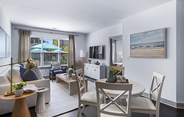 Dining room with modern furniture and elegant lighting at The Landing at Vinnin Square Apartments