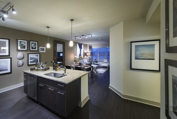 Modern kitchen with stainless steel appliances at The Landing at Vinnin Square Apartments