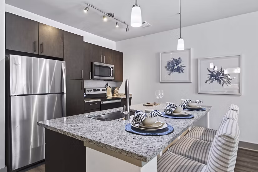 Modern kitchen with stainless steel appliances at The Landing at Vinnin Square Apartments