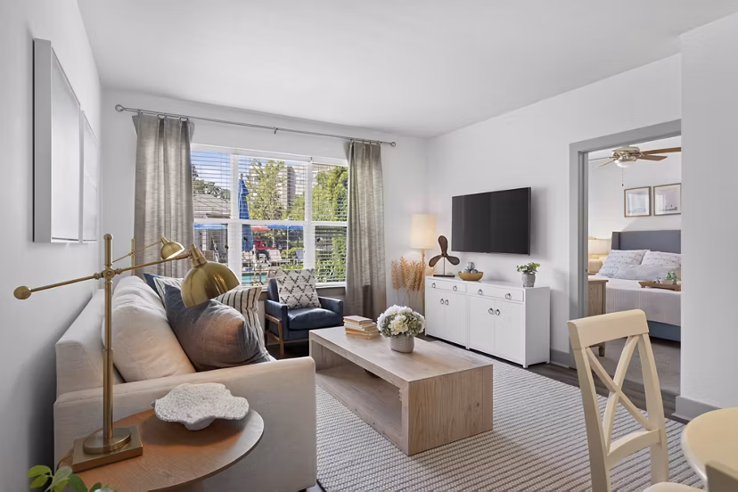 Spacious living room with modern decor in The Landing at Vinnin Square Apartments