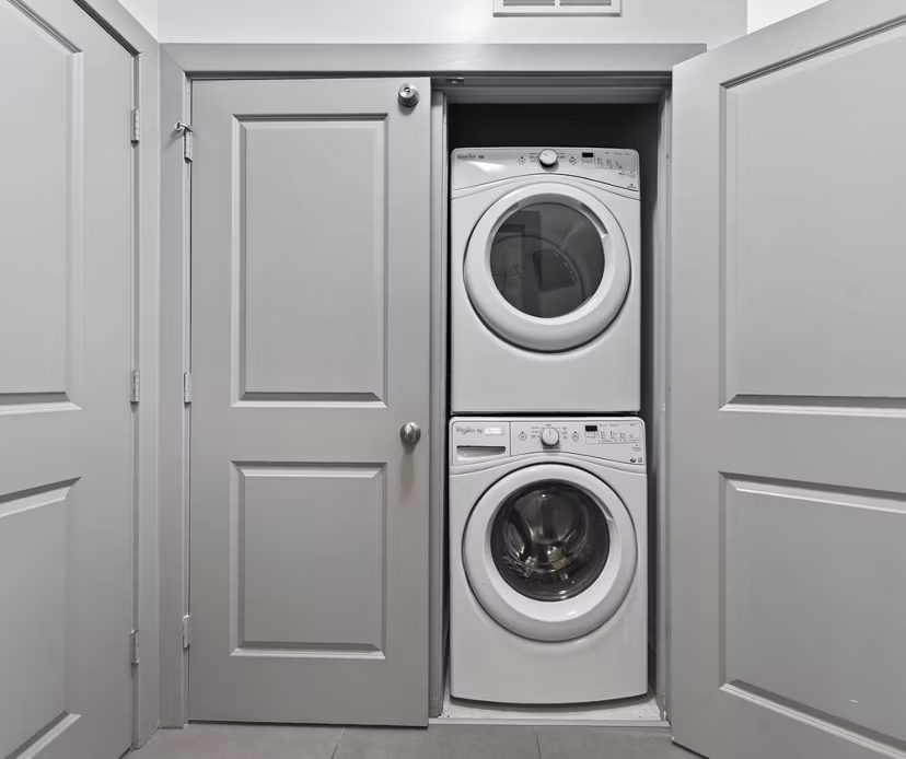 Laundry facility featuring modern washers and dryers at The Landing at Vinnin Square apartments