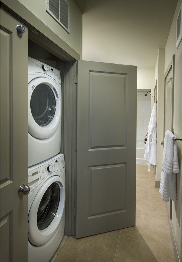 Laundry facility featuring modern washers and dryers at The Landing at Vinnin Square apartments