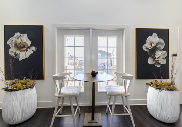 Clubhouse featuring a modern lounge and meeting areas at Ryder Junction Apartments, ideal for resident gatherings and events