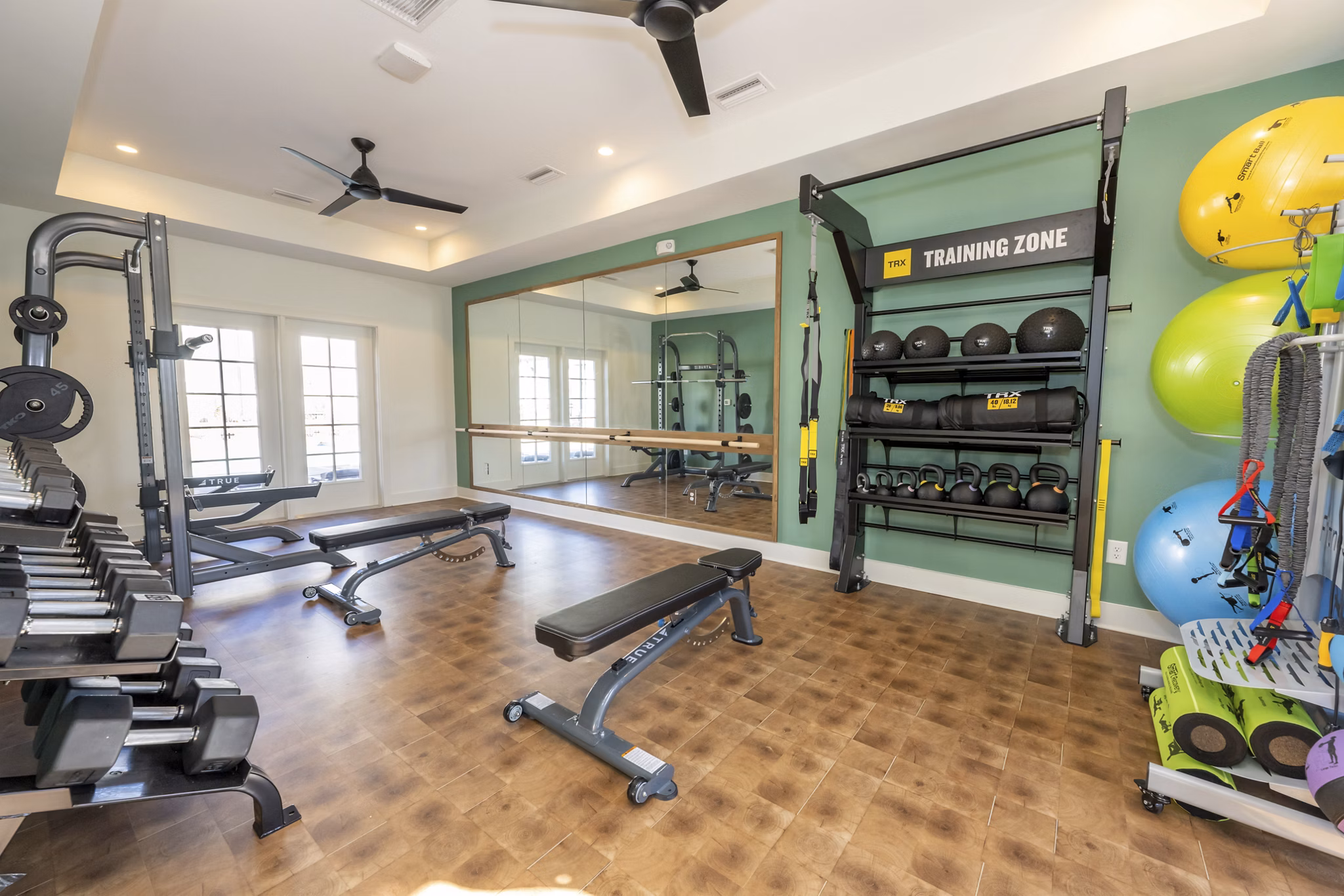 State-of-the-art fitness center with modern equipment at Ryder Junction Apartments offering a luxurious workout experience