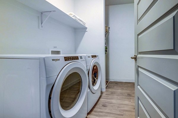 laundry room at Embold Apartments
