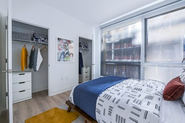 Cozy bedroom featuring elegant decor in SoNYa Apartments