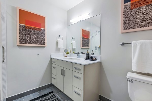Modern bathroom with sleek fixtures at SoNYa Apartments, a Greystar luxury community in downtown