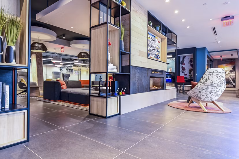 Clubhouse with modern decor and ample seating at SoNYa Apartments in New York City