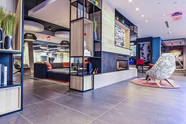 Clubhouse with modern decor and ample seating at SoNYa Apartments in New York City