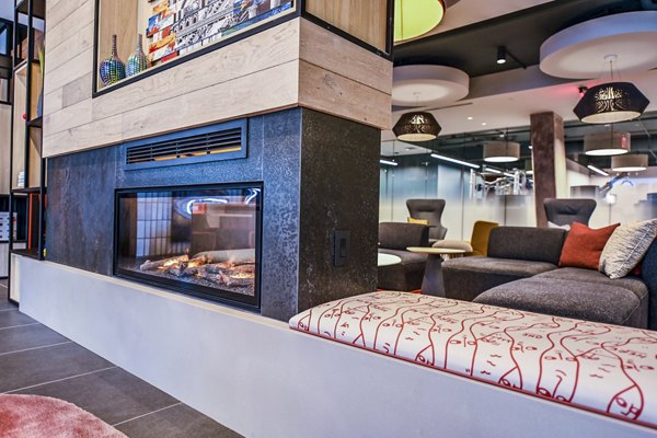 Clubhouse featuring modern design and seating at SoNYa Apartments