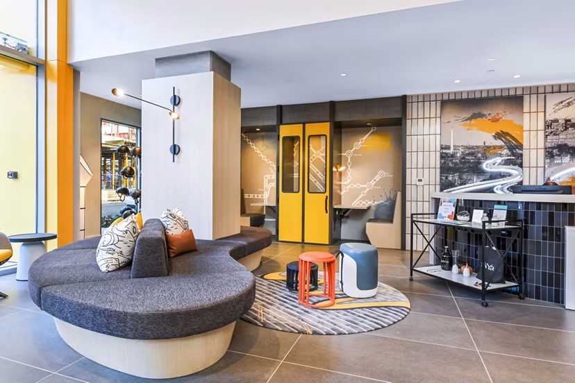 SoNYa Apartments: Stylish clubhouse lobby with contemporary furnishings and decorative lighting in New York City's vibrant SoHo neighborhood