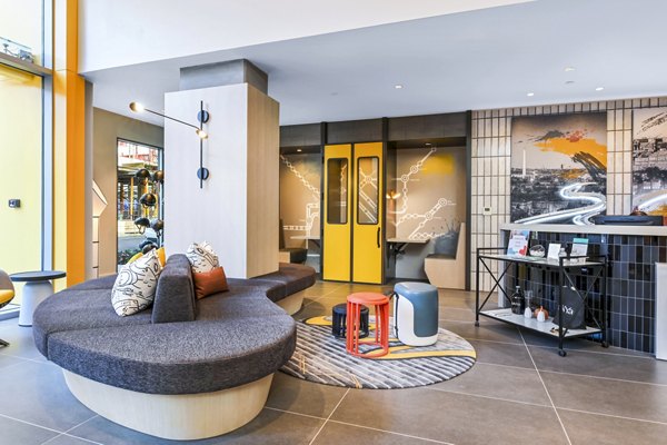 SoNYa Apartments: Stylish clubhouse lobby with contemporary furnishings and decorative lighting in New York City's vibrant SoHo neighborhood