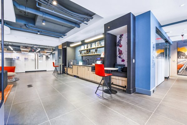 Stylish clubhouse with modern decor and cozy seating at SoNYa Apartments, a luxury living community in vibrant New York City