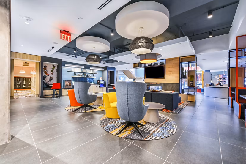 Clubhouse featuring modern design and cozy seating at SoNYa Apartments, Greystar luxury apartments