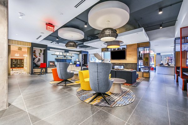 Clubhouse featuring modern design and cozy seating at SoNYa Apartments, Greystar luxury apartments