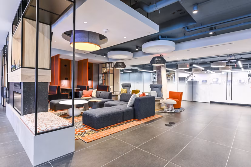 Clubhouse with modern seating and decor at SoNYa Apartments in New York City, perfect for social gatherings and events