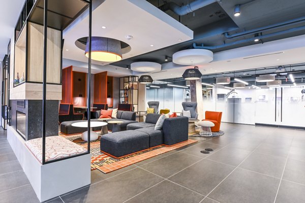 Clubhouse with modern seating and decor at SoNYa Apartments in New York City, perfect for social gatherings and events