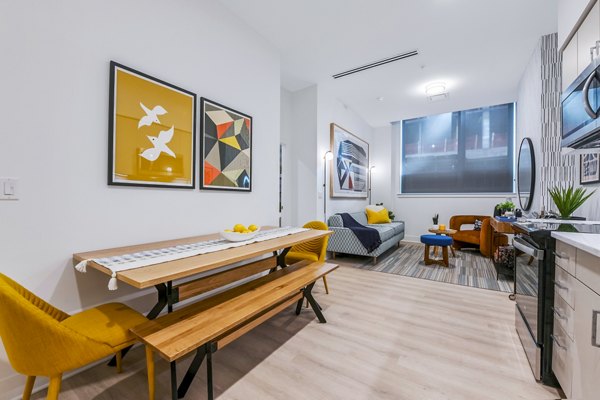 Dining room featuring modern decor and elegant lighting at SoNYa Apartments