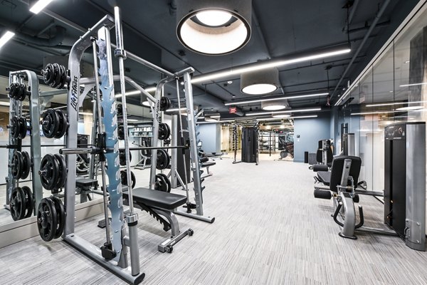 State-of-the-art fitness center with modern equipment at SoNYa Apartments